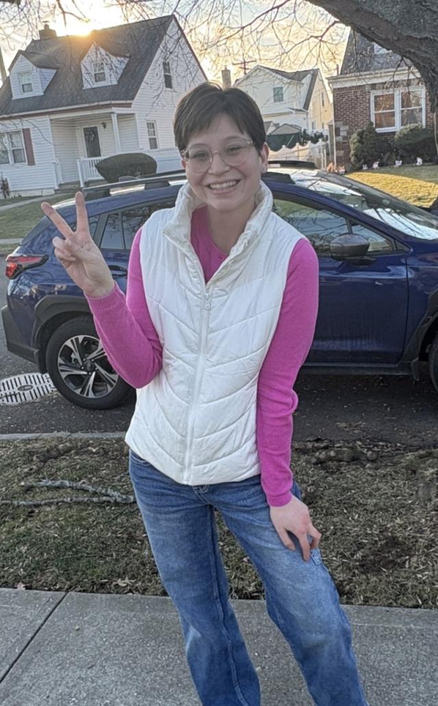 Cody posing and holding up a peace sign